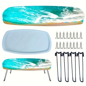 May include: A DIY resin table kit featuring a blue and white ocean wave design. Includes a resin table top, a mold, screws, and black hairpin legs. The table top is approximately 30 inches long.