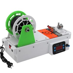 May include: A white 3D printer filament extruder machine featuring a green gear, a black spool, an orange fan cover, and a digital control panel with a red LED display. The device includes a power cord and metal components for filament processing.
