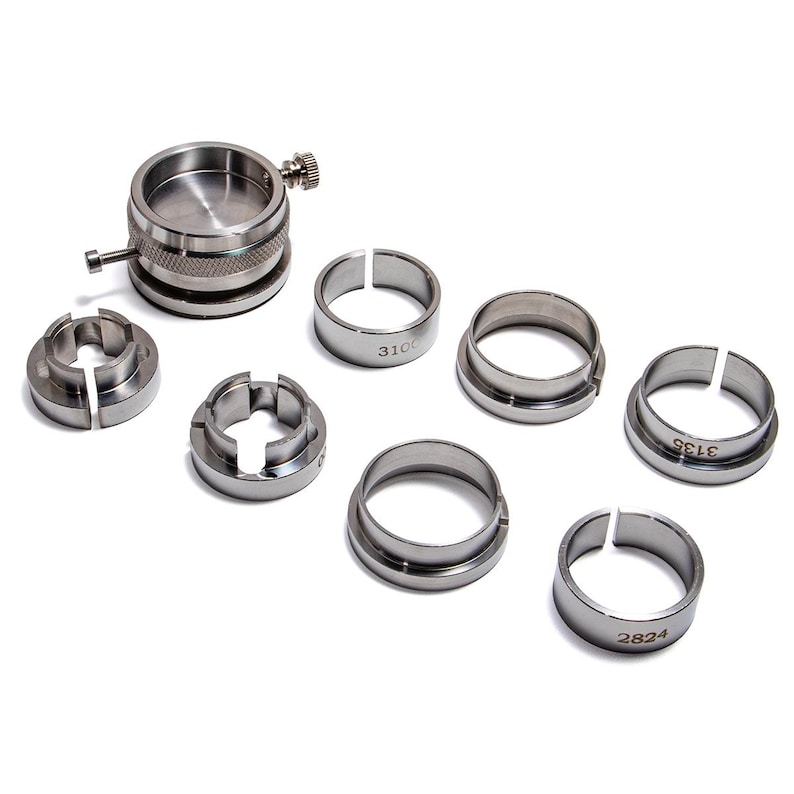 nine silver-colored metal rings or components, arranged on a white background.
