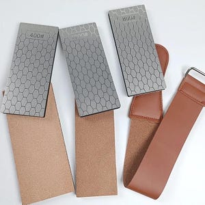 three different types of knives, each with a unique pattern and size, arranged on a white background.