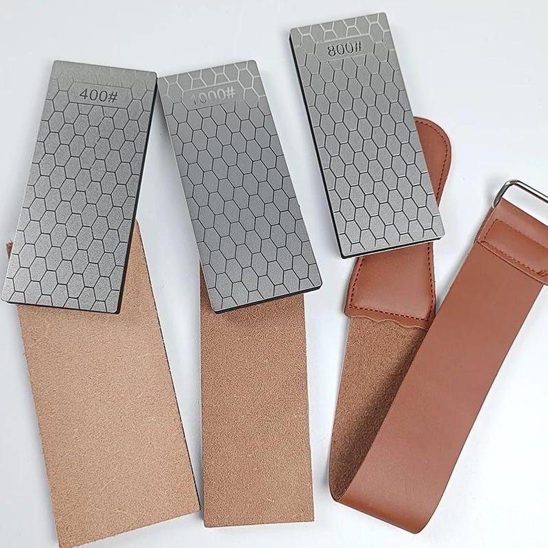 three different types of knives, each with a unique pattern and size, arranged on a white background.