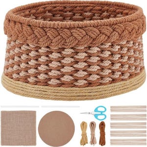 May include: A round, woven basket in shades of brown and beige, with a braided top edge. The image also includes craft supplies: burlap, a round cardboard piece, scissors, twine, and wooden strips. This basket is ideal for home decor.