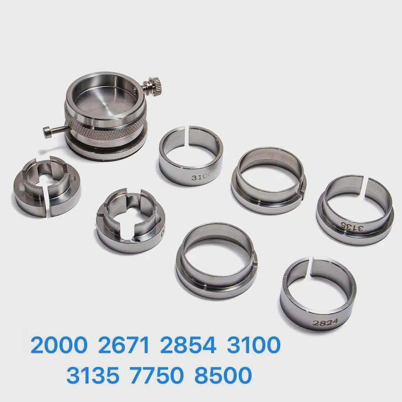 various metal rings and components, likely used in a manufacturing or assembly process.