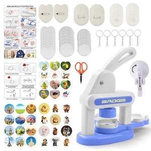 May include: A white and blue badge making machine with a lever, accompanied by various circular and heart-shaped metal components, pin backs, keychains, a pair of orange-handled scissors, a paper cutter, and instructional sheets with diagrams.