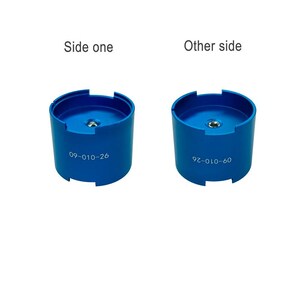 two blue cylindrical objects, one labeled "Side one" and the other labeled "Other side", both with the number "09-01-10-26" printed on them.