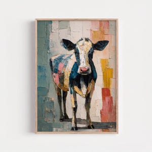 May include: A framed art print of a cow. The cow is painted with a textured, impressionistic style, featuring a mix of colors including blue, pink, yellow, and white. The background has a colorful, blocky design.