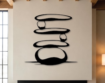 May include: A black metal wall art piece featuring a stacked design of four smooth, rounded, pebble-like shapes. The composition includes two smaller circular elements positioned between the larger, elongated, horizontal oval forms.