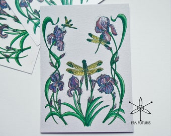 Flying dragonflys insect in purple irises flowers greeting card on sparkling pearl shimmer paper