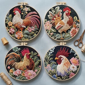May include: Four embroidered rooster designs in wooden hoops. Each features a detailed rooster surrounded by colourful flowers and foliage against a black background. The roosters have red combs and various feather colours.