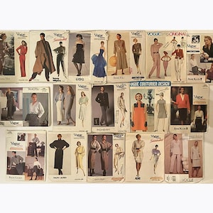May include: A selection of vintage Vogue sewing patterns. The patterns showcase illustrations of diverse fashion designs, including dresses, coats, and suits. The covers display the Vogue logo and designer names, representing a range of styles from different periods.