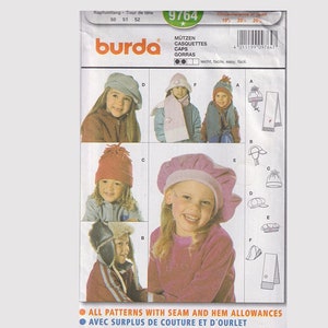 May include: A Burda pattern envelope displaying children's hat designs. The cover showcases images of children wearing different hats, such as berets, beanies, and earflap hats. Text includes "MÜTZEN CASQUETTES CAPS GORRAS" and "ALL PATTERNS WITH SEAM AND HEM ALLOWANCES."