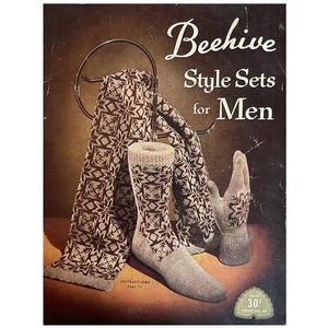 May include: A vintage magazine cover shows a knitted scarf, socks, and gloves with a geometric pattern in brown and white. The text reads "Beehive Style Sets for Men."