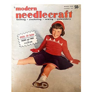 May include: Vintage "Modern Needlecraft" magazine cover showing a girl in a red sweater, hat, and gloves, and a navy blue skirt. The magazine cover has text that reads "knitting, crocheting, sewing, embroidery". The magazine also has a "Winter Issue" label.