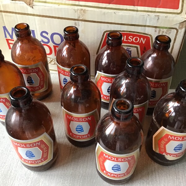 Vintage 70er Jahre Braunglas Bierflaschen und Koffer Molson Export Ale Box 10 leere Flaschen & verprügelte 12er-Pack Box