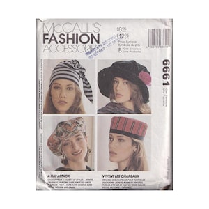 May include: McCall's Fashion Accessories pattern 6661 envelope featuring four hat styles: a striped knotted cap, a black wide-brimmed hat with a pink accent, a floral print beret, and a red and black striped pillbox hat with text and pricing.