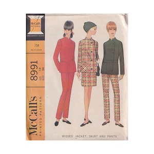 May include: A vintage McCall's sewing pattern showing three outfits: a red trouser suit, a plaid jacket and skirt, and a green jacket with plaid trousers. The pattern is for a 34-inch bust (86 cm). The package is labelled "Misses' Jacket, Skirt and Pants."