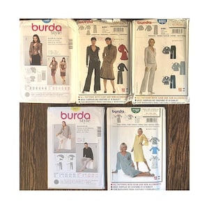 May include: A selection of Burda Style sewing pattern envelopes. The patterns showcase designs for jackets, trouser suits, dresses, and loungewear. The envelopes show images of the finished garments and include sizing information.