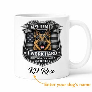 May include: White ceramic mug featuring a German Shepherd dog illustration within a K9 Unit badge design. The badge includes the text "I WORK HARD" and "K9 Rex". The mug has a white handle and is suitable for hot or cold beverages.