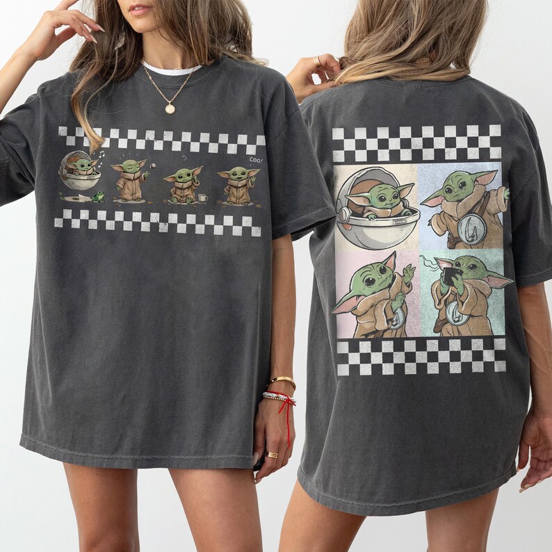 May include: Dark grey t-shirt with a graphic of a green alien character in various poses, and a checkered border. The back of the shirt also displays the character in different scenes, with a checkered border.