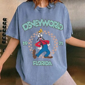 May include: A rustic wooden sign with the text "Welcome to our home" in white lettering. The sign features a distressed finish and a simple, inviting design, perfect for a front porch or entryway.