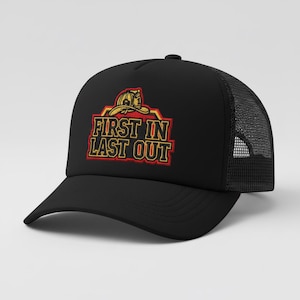 May include: A black trucker hat featuring a mesh back and a solid front panel. The front displays an embroidered graphic of a yellow firefighter helmet above the text FIRST IN LAST OUT in yellow letters with a red and black outline border.