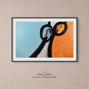 May include: Abstract art print in a black frame. The artwork features a blue and orange background with black and white shapes. The text "STILL & DRIFT DIGITAL DOWNLOADS" is at the bottom.