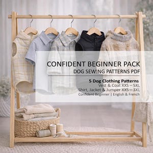 May include: A wooden clothing rack displays five dog clothing patterns, including vests, coats, shirts, jackets, and jumpers. The patterns are labeled "Confident Beginner Pack" and include sizes XXS to 5XL. A basket with folded fabric and sewing supplies sits below.