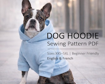 May include: A Boston Terrier dog wearing a light blue hoodie. The dog is sitting and looking at the camera. Text on the image reads "DOG HOODIE Sewing Pattern PDF" and "Sizes XXS-5XL | Beginner Friendly English & French".