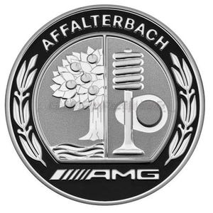 May include: A circular emblem with a black border and silver interior. The emblem features a tree on the left and a stylized design on the right, with the word "AFFALTERBACH" at the top and "AMG" at the bottom.