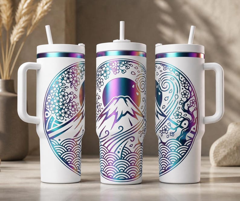 May include: White insulated tumbler with a handle and straw, featuring a Japanese-inspired design. The design includes a mountain, cherry blossoms, and waves in shades of purple, blue, and teal. The tumbler has a white lid and handle.