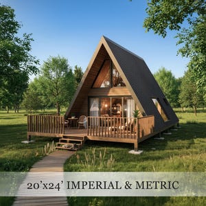 May include: A-frame cabin with a wooden deck and a dark gray corrugated metal roof. The cabin has large windows and a door leading to a small deck with chairs and a table. The cabin is surrounded by trees and grass. The text on the image says "20'x24' IMPERIAL & METRIC".