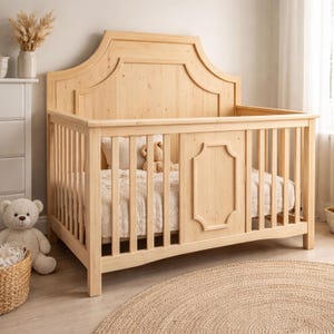 May include: A light-colored wooden crib with a decorative headboard and side rails. The crib is filled with a white blanket and a teddy bear. A woven basket and a teddy bear are in the foreground.