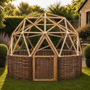 May include: A wooden garden dome with a woven willow base and a geometric wooden frame. The dome is set on a green lawn, surrounded by greenery and a stone building in the background. The structure has a door.