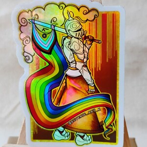 May include: A sticker featuring a knight in silver armor holding a sword and a rainbow flag. The sticker has a holographic effect with a gold border and the text "@REVERIE_ART_K". The knight is set against a gradient background.