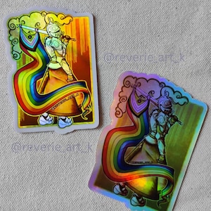 May include: Two holographic stickers featuring a knight holding a sword and a rainbow banner. The stickers have the text "A GRADE STICKER" and "B GRADE STICKER". The knight is wearing armor and sneakers. The background is a gradient of gold and green.
