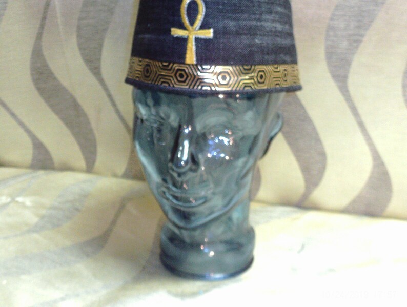 Completely Handmade from Black Denim this crown is custom designed the a Gold Egypt Ankh front and Center and completed with gold ribbon.