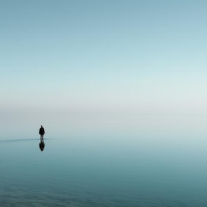 May include: A set of three ceramic mugs with a speckled, matte finish. The mugs are in shades of cream, light gray, and dark gray. Each mug has a simple, minimalist design, perfect for coffee or tea.