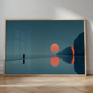 May include: Framed art print featuring a solitary figure walking towards a large, orange sun setting over a calm body of water. The artwork has a minimalist style with a teal and orange color palette, and a wooden frame.