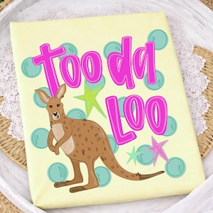 May include: A light yellow canvas with a cartoon kangaroo illustration and the words "Tooda Loo" in bright pink. The design includes teal polka dots and star accents, creating a playful and whimsical aesthetic.