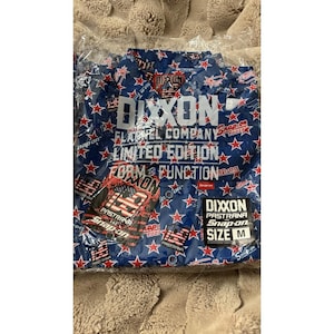 May include: A blue flannel shirt with a red star pattern and white text. The shirt is from the DIXXON Flannel Company, a limited edition, and features the text "FORM AND FUNCTION". The shirt is size M.