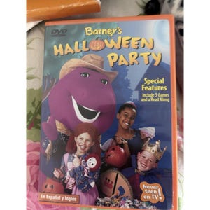 May include: DVD of Barney's Halloween Party. The cover features Barney the dinosaur in a cowboy hat, with children in Halloween costumes. Text includes "Special Features" and "Never seen on TV."