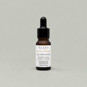 May include: A small, brown glass bottle with a black dropper top. The label reads "Crave Control" and lists ingredients like grapefruit, lemon, rosemary, and lavender. The bottle contains 0.34 fl oz / 10 ml of essential oil blend.