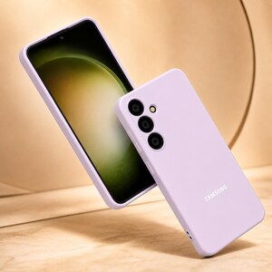 May include: A light purple phone case and a smartphone with a black screen are displayed. The phone case has three camera cutouts and the Samsung logo. The phone screen displays a green and yellow gradient.