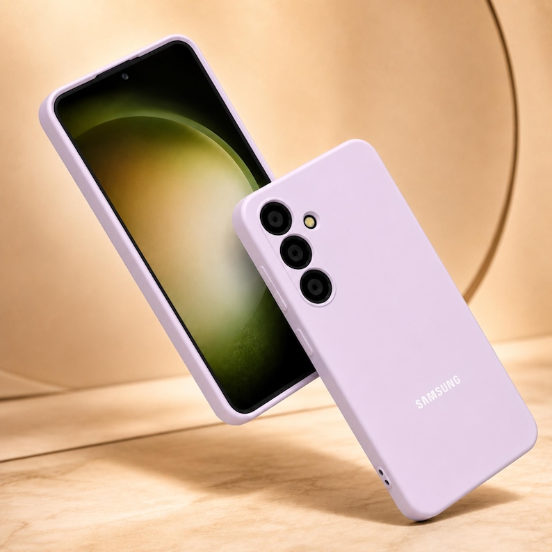 May include: A light purple phone case and a smartphone with a black screen are displayed. The phone case has three camera cutouts and the Samsung logo. The phone screen displays a green and yellow gradient.