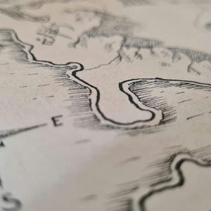 May include: Detailed black and white map illustration with a compass rose indicating North, East, South, and West. The map depicts coastlines, rivers, and land features, suggesting a fantasy or historical theme. The paper has a slightly aged appearance.