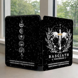 May include: Black decorative screen with a celestial design. One side features a moon phase illustration, the other a dragon and text that reads "BASGIATH WAR COLLEGE". The screen has a quote: "A dragon without its rider is a tragedy: A rider without their dragon is dead."