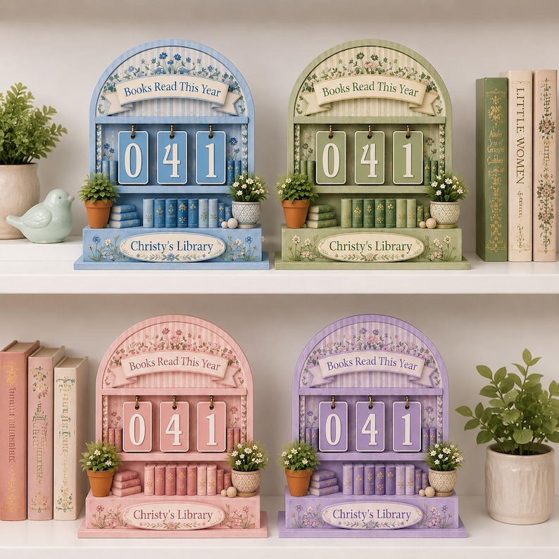 May include: Four decorative book-themed perpetual calendars in blue, green, pink, and purple. Each calendar displays "041" and the text "Books Read This Year" and "Christy's Library". Miniature potted plants and books are included.