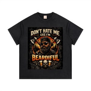 May include: Black t-shirt with a graphic of a bearded man in sunglasses and a cap, crossed axes, and the text "DON'T HATE ME CUZ I'M BEARDIFUL". Two beer mugs with skulls are at the bottom of the design.