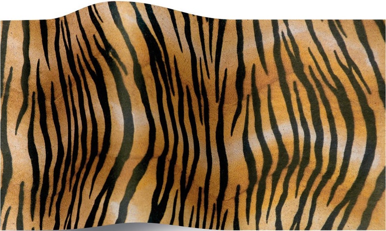 May include: A close-up of a tiger print fabric with orange and black stripes. The fabric has a slightly textured surface.