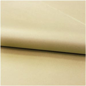 May include: A sheet of light tan, matte-finish paper folded over to create a soft, curved crease. The surface of the paper appears smooth and uniform in color, showing a consistent, neutral beige tone across the entire visible area of the material.